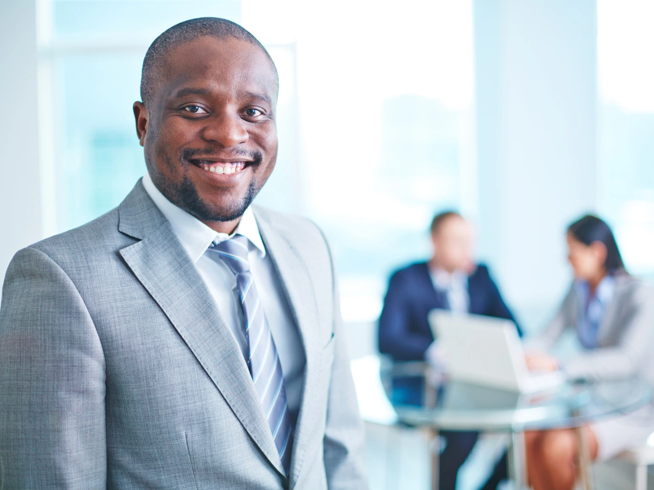 a man in suit, smiling